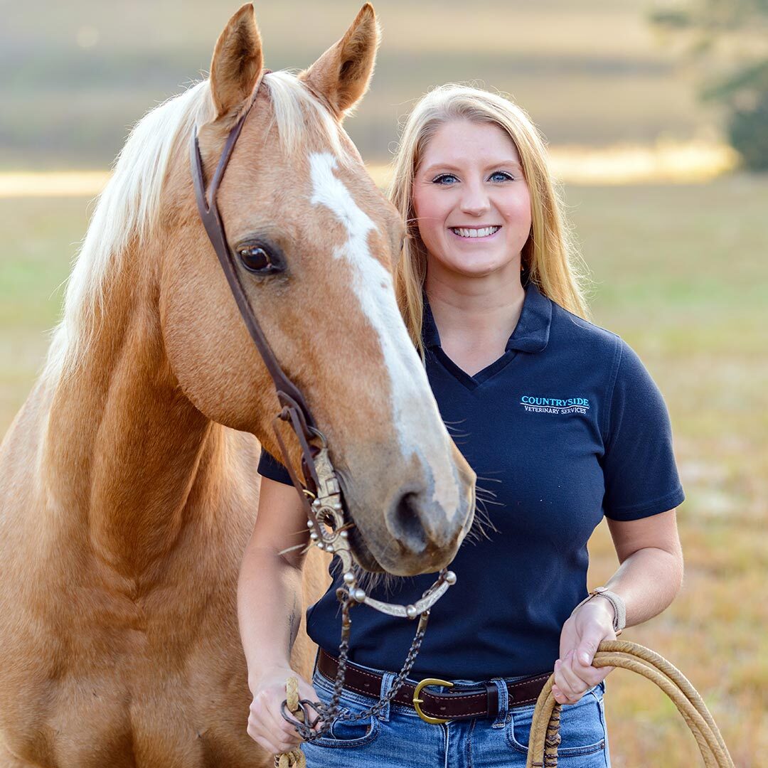 Photo And Video Release Form For Countryside Veterinary Services Equine female veterinarian smiling and posing with brown horse outside